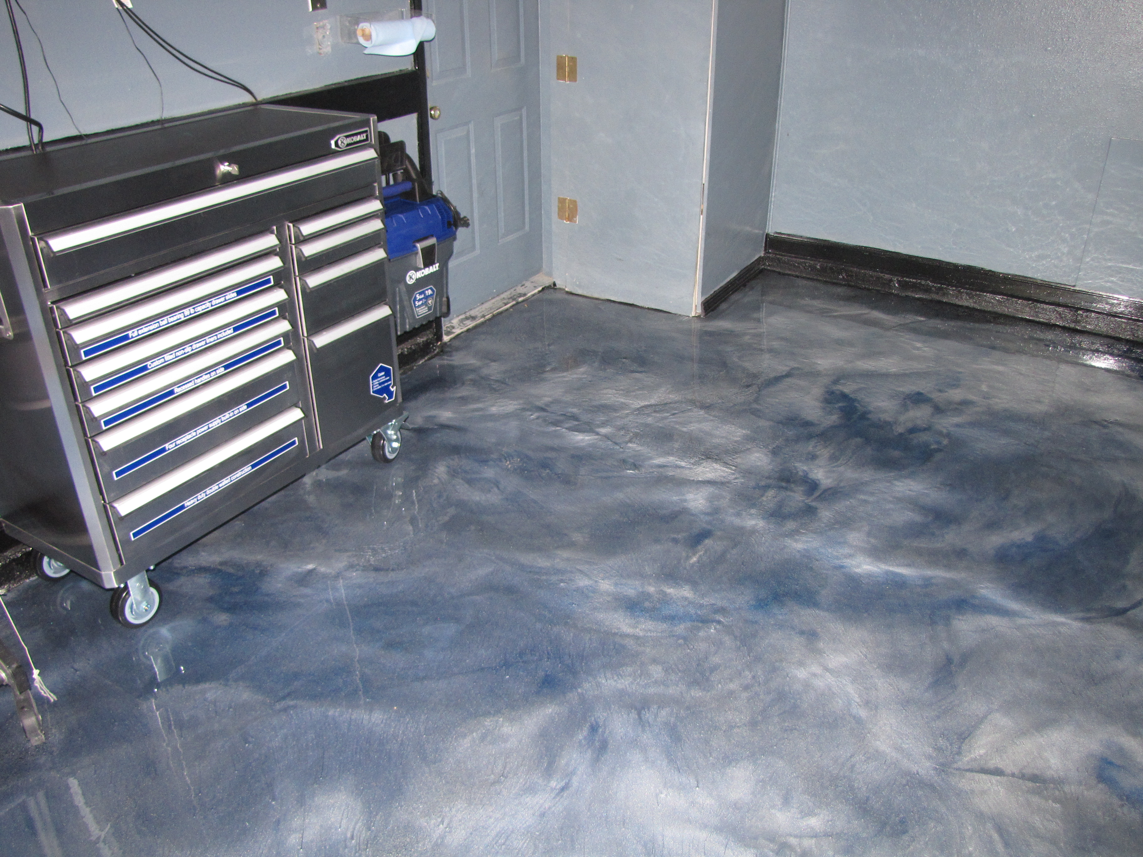 Garage Floor Coated With Metallic Epoxy Mvl Concretes Blog